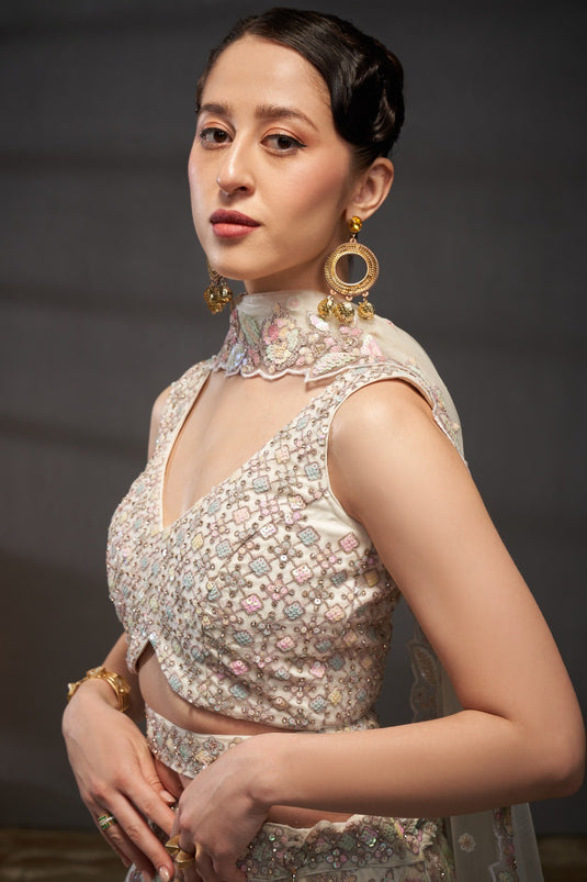 Cream Net Multicolor Sequins Embroidered Semi Stitched Bridal Lehenga Choli