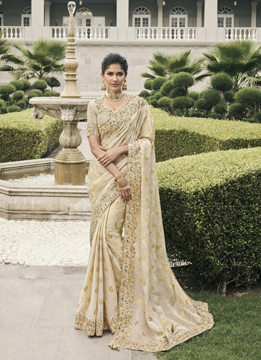 Beige Tissue Silk Stone Pearl Embroidered Mirror Work Festive wear Saree