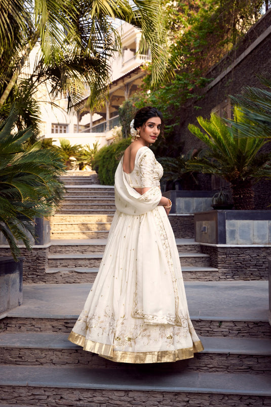 Off White Sequins Embroidered Silver Glossy Semi Stitched Bridal Lehenga Choli