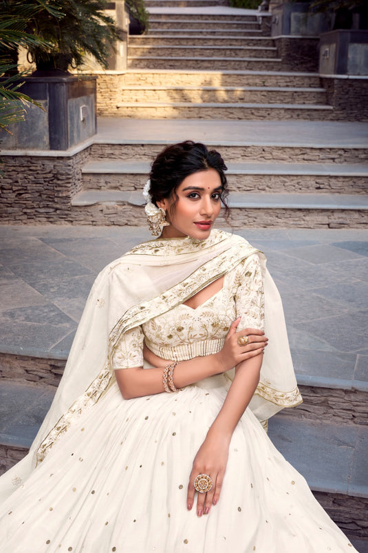 Off White Sequins Embroidered Silver Glossy Semi Stitched Bridal Lehenga Choli